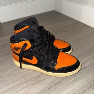 Nike Jordan Black and Orange Patent leather Sneakers